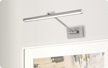 A picture light adds focus to the decorative accents you curate in your space