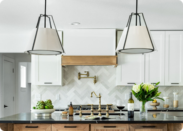 Kitchen island pendant lighting providing task lighting in a multi use kitchen space.