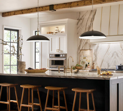 A modern kitchen showing layers of light in use during the daytime.
