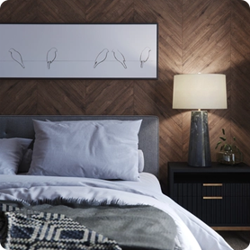 A bedside lamp adds lighting for nighttime reading