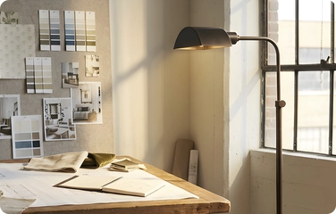 A floor or table lamp provides the focused light needed for various tasks