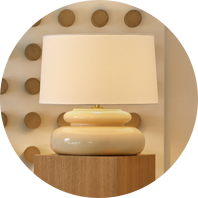 A table lamp with a fabric shade provides illumination without glare