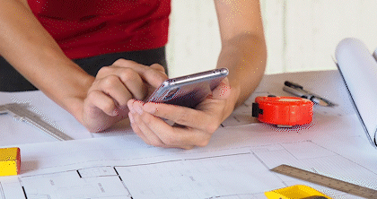 A design professional scrolls through the lighting options provided by Beacon.