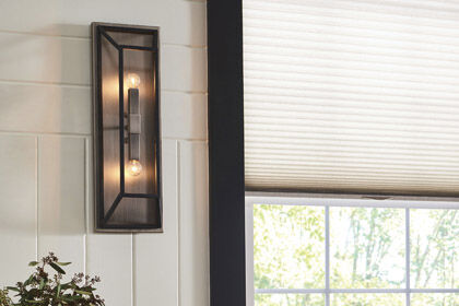 A chic, stylish wall sconce in a modern living space.