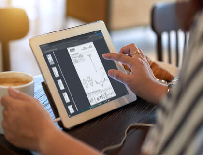 A designer double-checks fixture installation details to pass on to the installers.