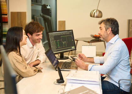 Designer explaining lighting service pricing and value to a residential client.