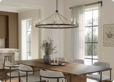 Dining chandelier lighting defining a dining area within an open floor plan home.