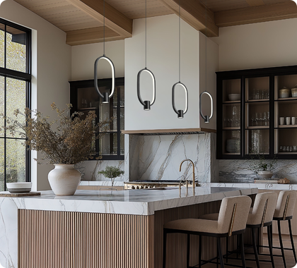 Kitchen island pendant lighting scaled properly for high ceilings and open floor plan.