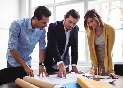 Architect explaining lighting finishes and scale to client during consultation