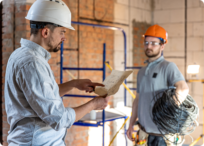 Construction team coordinating lighting installation requirements.