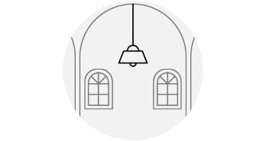 A small chandelier dwarfed by the room around it.