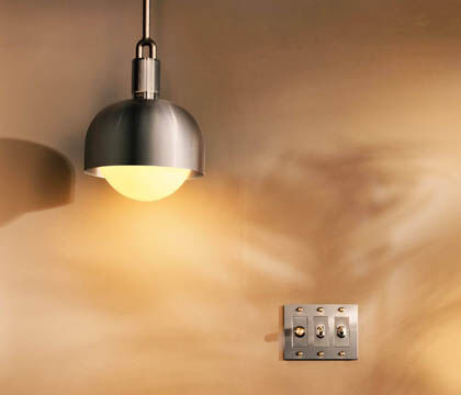 Energy-efficient LED lighting with dimmers supporting sustainable interior design.