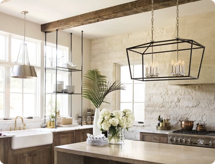 Matte black lighting fixtures and other kitchen hardware forms a strong anchor for other metallic finishes