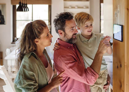 A family easily accessing their fully-integrated home ecosystem.