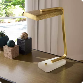 A desk lamp provides the perfect illumination for an office desk or other work space