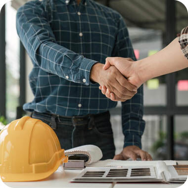 A builder and client agree on smart home integration at the start of construction.