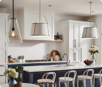 A simply luxurious eat-in kitchen elevated by a mix of metal finishes.