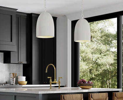 Directional pendants above a kitchen island provide focused task lighting