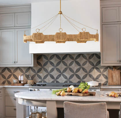 Linear lighting fixture centered above modern kitchen island