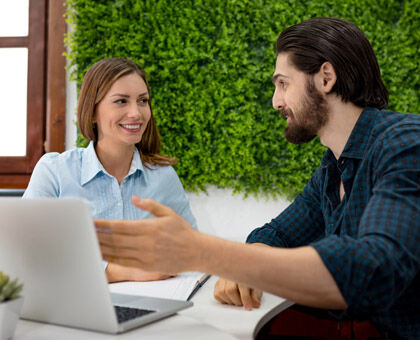 Interior designer explaining lighting plan to homeowner, starting with general goals.