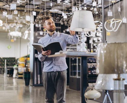Lighting expert helping select fixtures for lighting plan