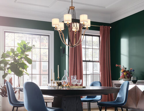 Statement chandelier creating a dramatic focal point in a modern home office.