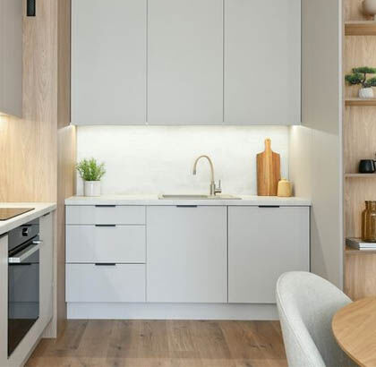 LED undercabinet lighting illuminating kitchen countertops and backsplash