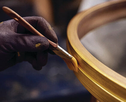 Hand-applied finishes are one factor that elevate designer lighting in look and price.