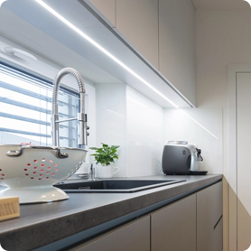 Undercabinet lighting illuminates a workspace that may otherwise by obscured in shadow