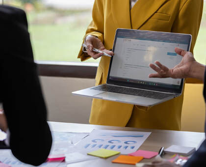 Designer presenting curated lighting fixture options to streamline client decisions.