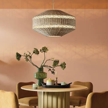 A warm, cozy dining space illuminated by a natural chandelier.